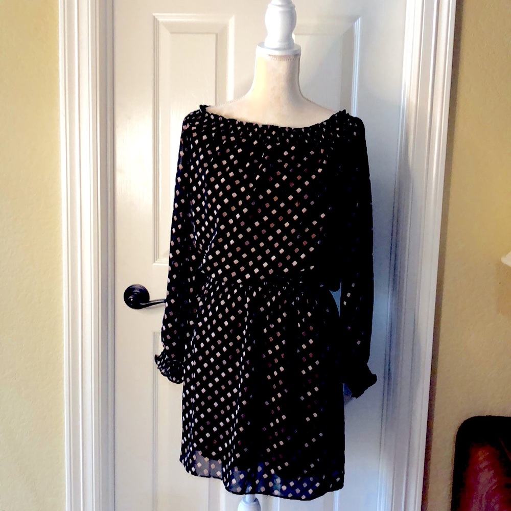 Dress has contemporary vibe. White House Black market.